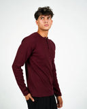 Dorian burgundy ribbed long-sleeve Henley shirt, front three-quarter view on a male model.