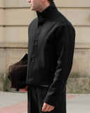 Dorian funnel neck jacket in black, cropped structured jacket with standing collar and button front, back view