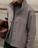 Dorian funnel neck jacket in taupe, cropped structured jacket with standing collar and button front, styled on model